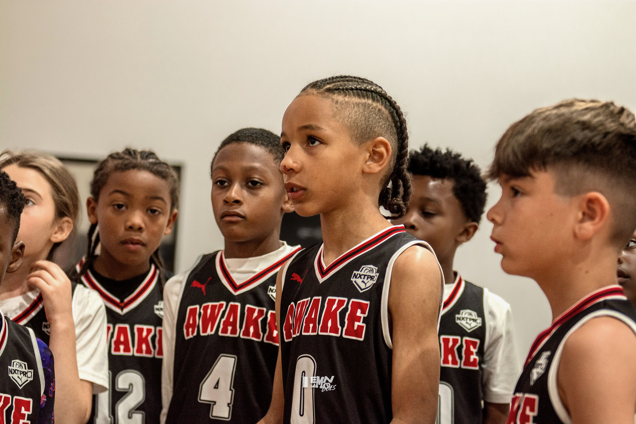 AWAKE players listening in a huddle